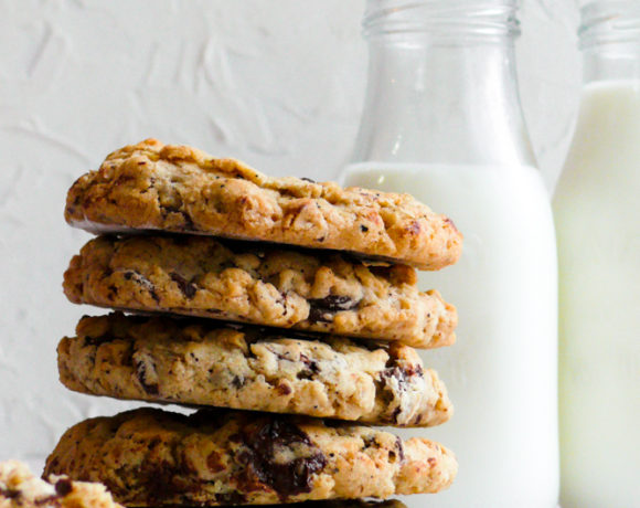 Stacked Brown Butter Oatmeal Cookies with a glass of milk