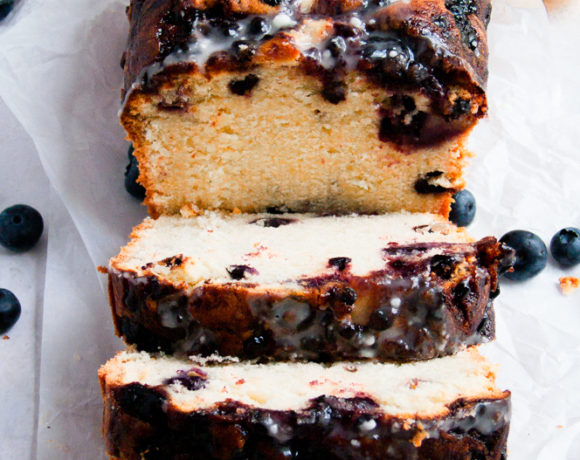 3 pieces of sliced stacked cake on a piece of parchment exposing middle of cake