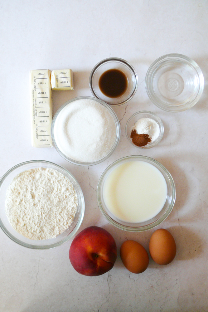 All the upside down cake ingredients laid out on a white background