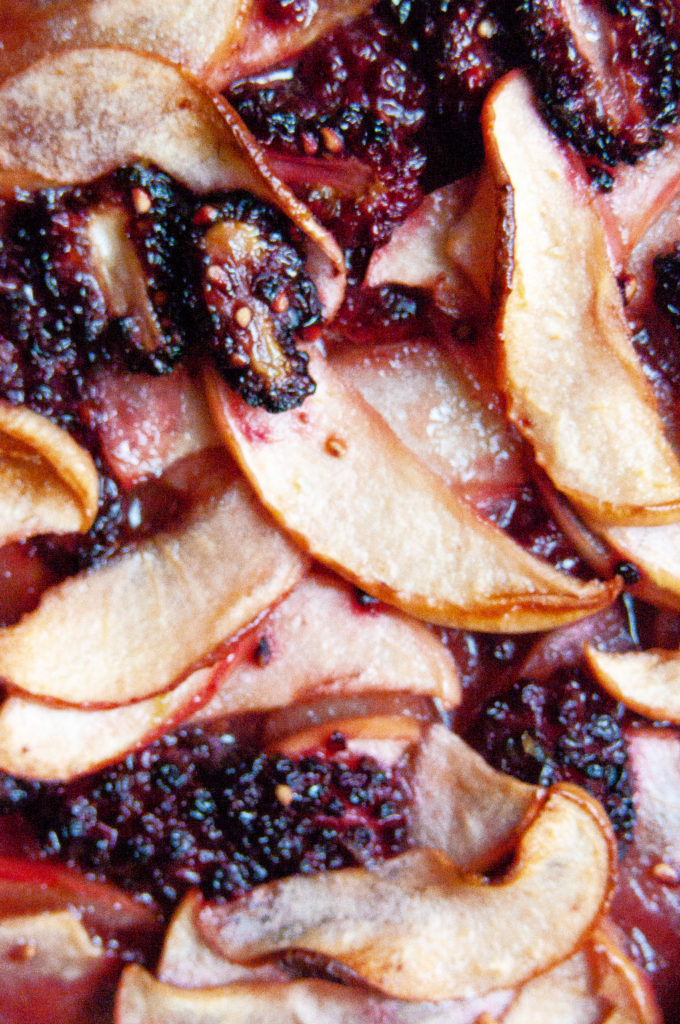 Macro shot of the apples and blackberries in the galette