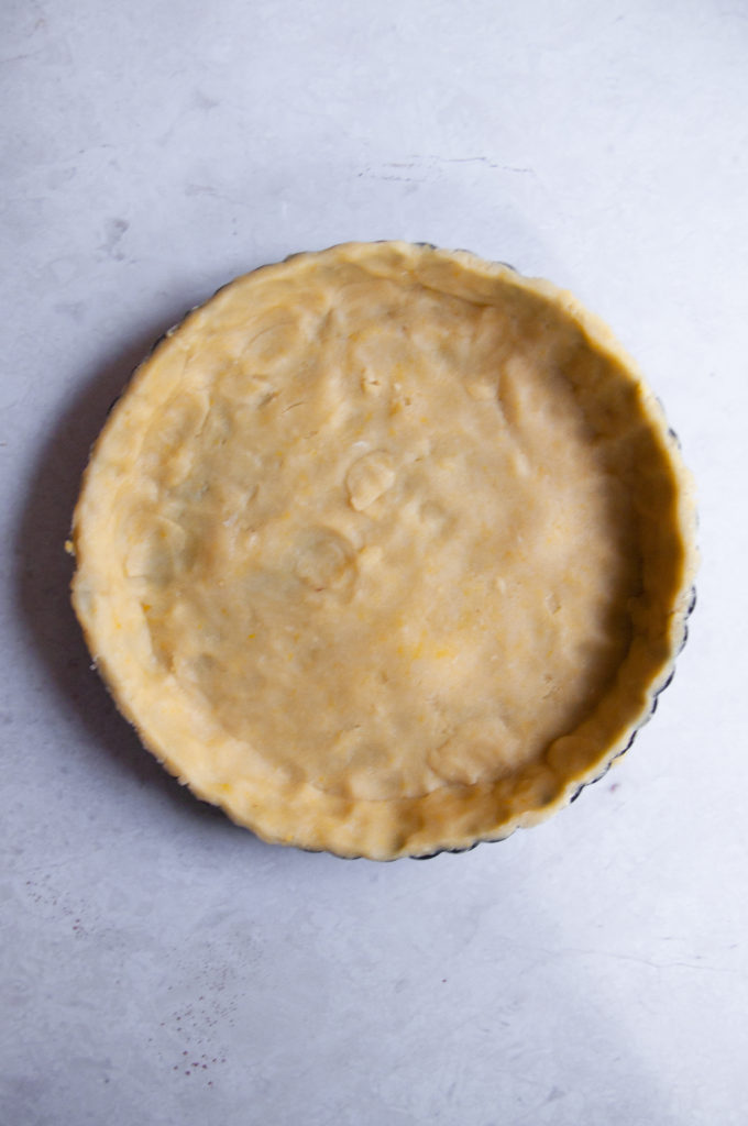 The buttery tart shell laid out in an overhead shot